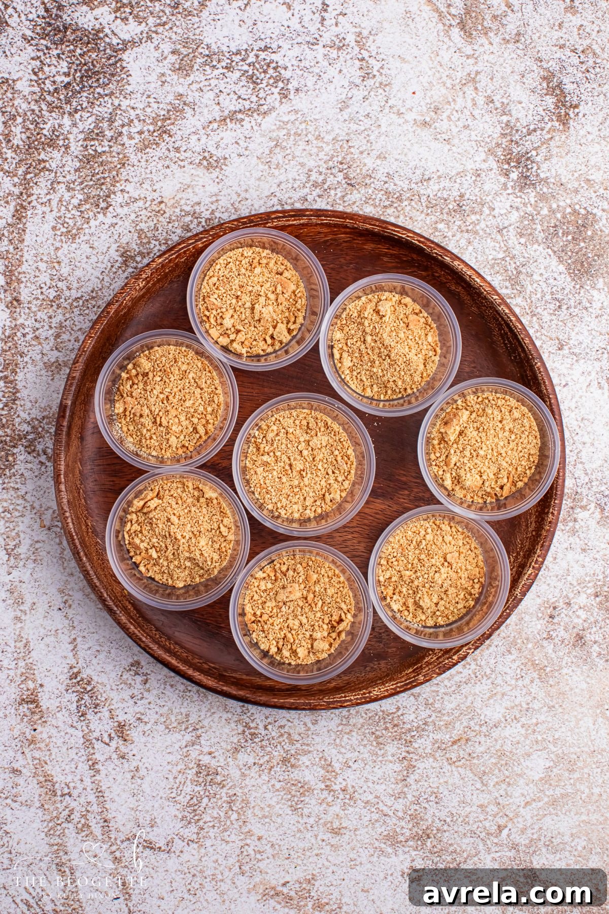 Spoon graham cracker crumbs into the bottoms