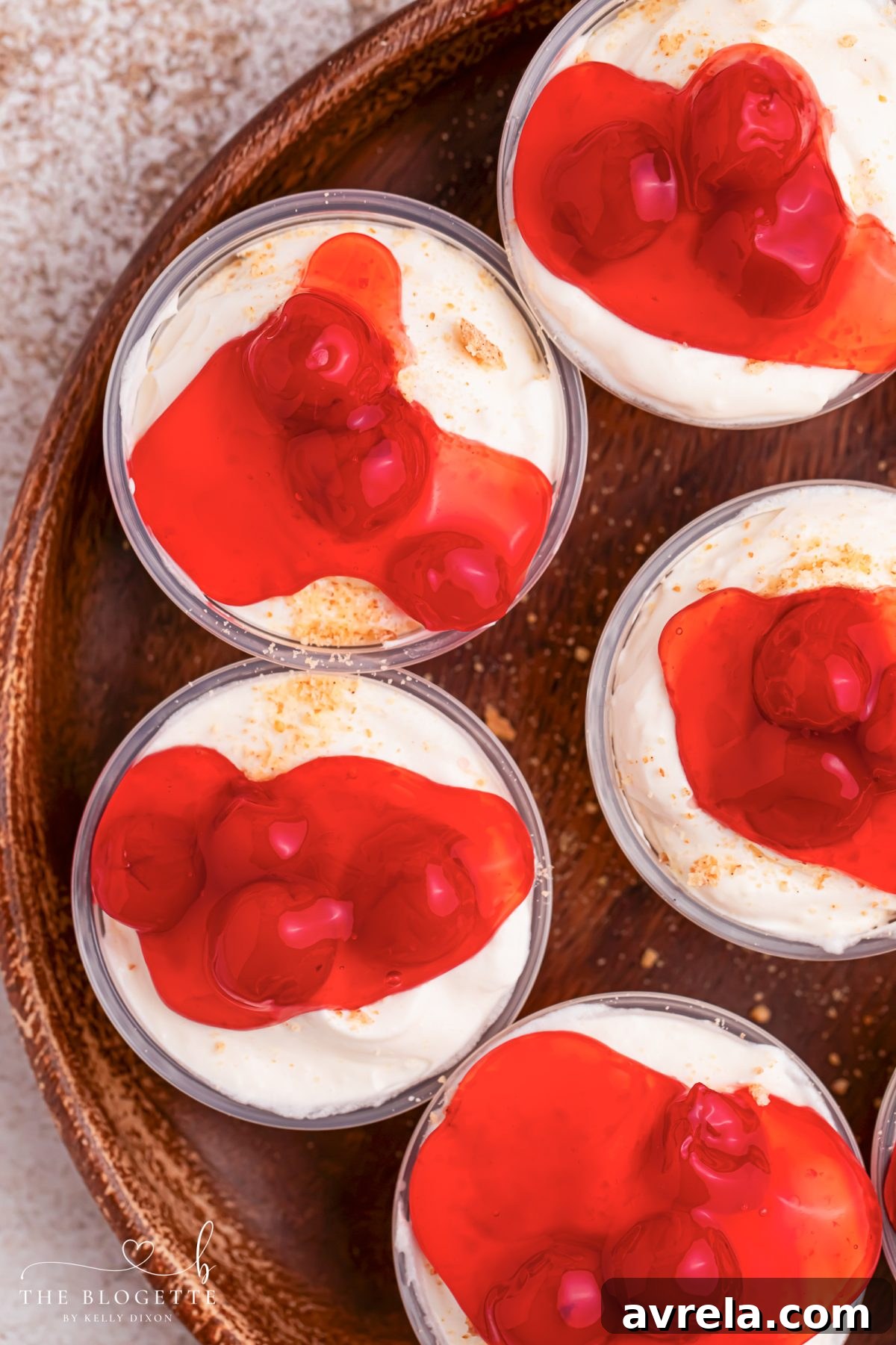 Cherry Cheesecake Shots 🍒✨ The perfect no-bake party dessert! Made with cheesecake pudding, Cool Whip, RumChata, graham crackers, and cherry pie filling. Easy dessert shooters for holidays, girls’ night, brunch, and celebrations. Try this simple make-ahead dessert idea!