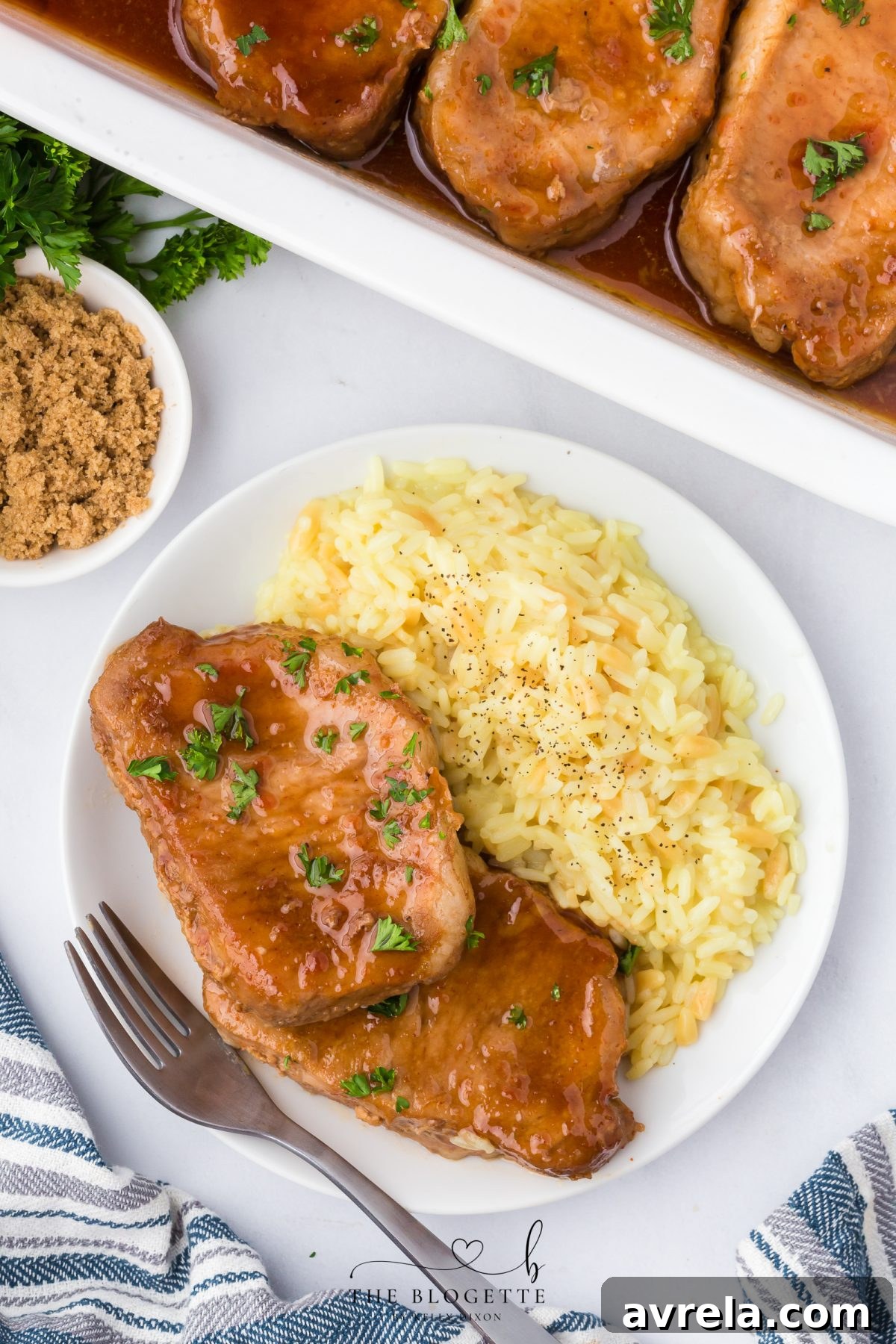 Beautifully glazed Brown Sugar Pork Chops served with a side
