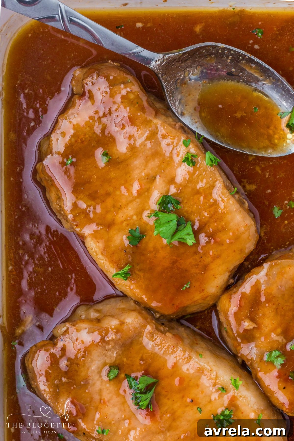 These Brown Sugar Pork Chops are coated in a rich, buttery, sweet-and-savory glaze that bakes into juicy perfection. Easy weeknight recipe with oven and crock pot options! Save this family-favorite pork chop idea for dinner tonight.