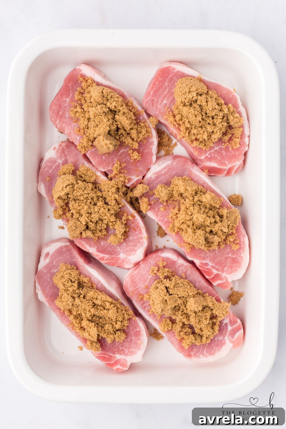 Arrange pork chops and top with brown sugar