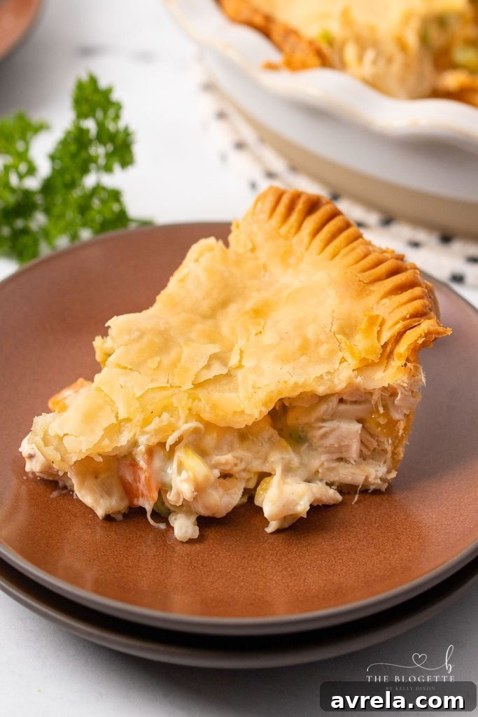 A close-up of a freshly baked Homemade Chicken Pot Pie, showing its crispy, golden-brown crust.