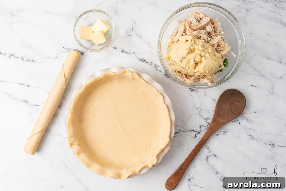 Step-by-step image showing how to make the chicken pot pie filling in a large mixing bowl.