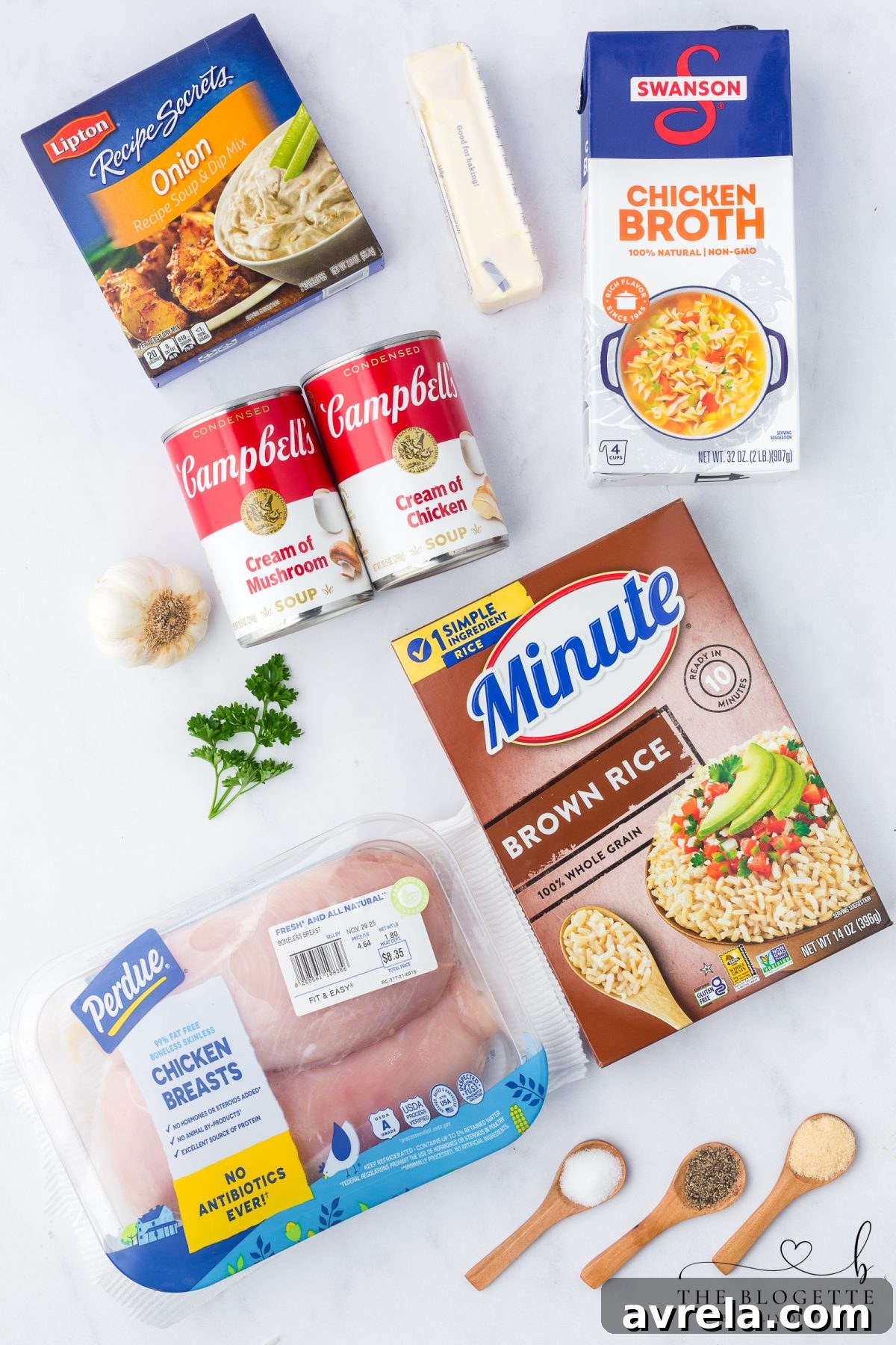 Ingredients for Forgotten Chicken Casserole, including minute brown rice, cream soups, chicken broth, butter, roasted garlic, onion powder, chicken breasts, salt, pepper, and Lipton onion soup mix.