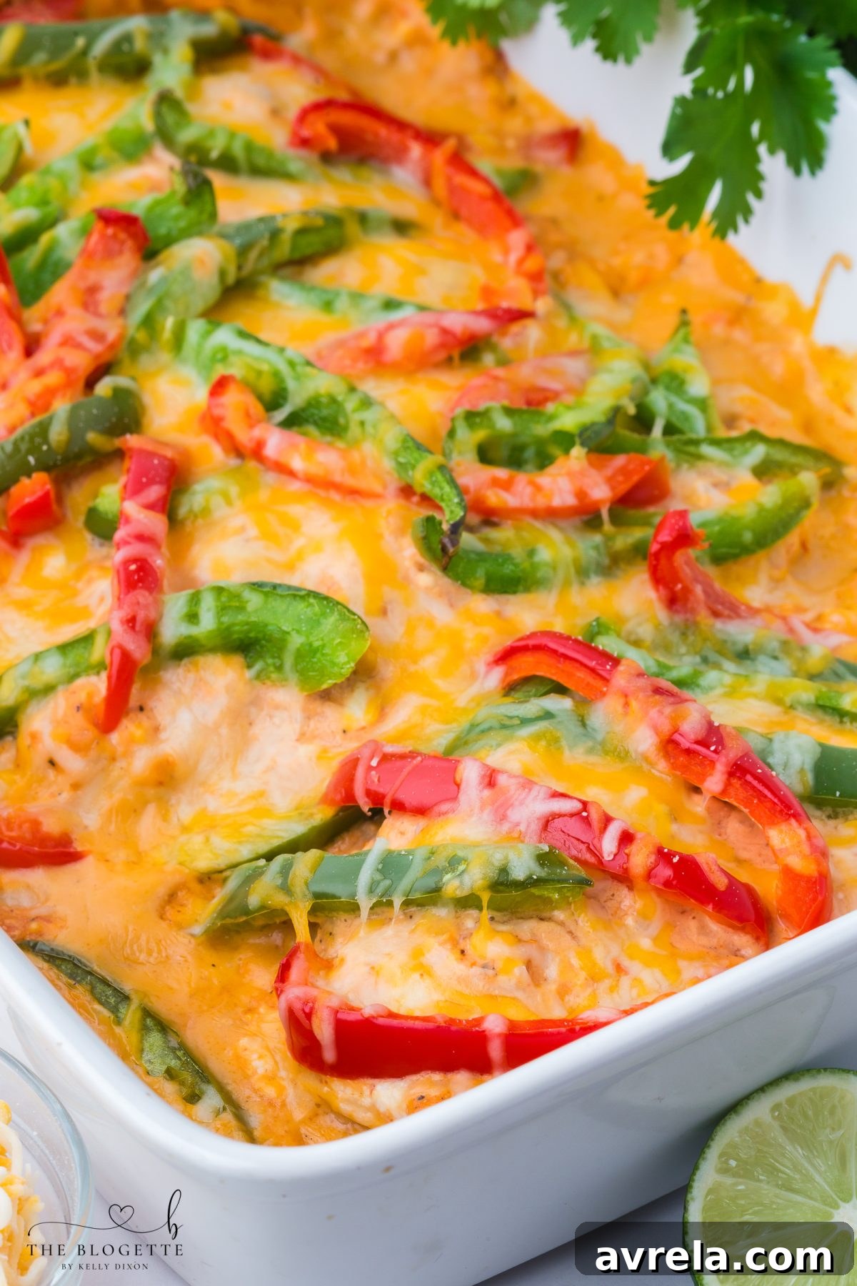 An overhead shot of a prepared chicken fajita casserole before baking, showcasing fresh ingredients.