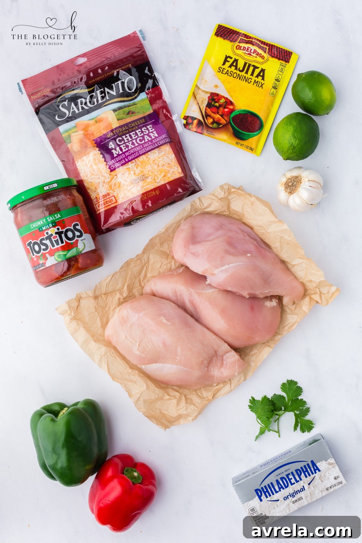 A selection of fresh ingredients laid out for making the chicken fajita casserole, including chicken, peppers, and cheese.