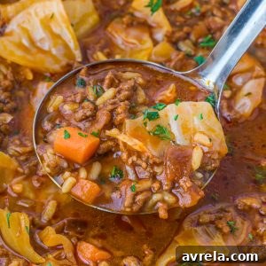 Hearty cabbage soup with ground beef, tender cabbage, tomatoes, and rice simmered in a rich broth.