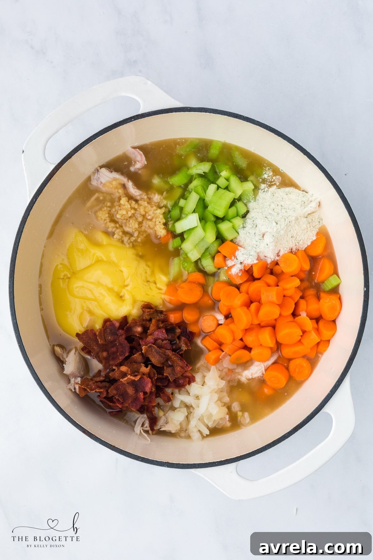 Combining all ingredients in a large pot for Crack Chicken Soup