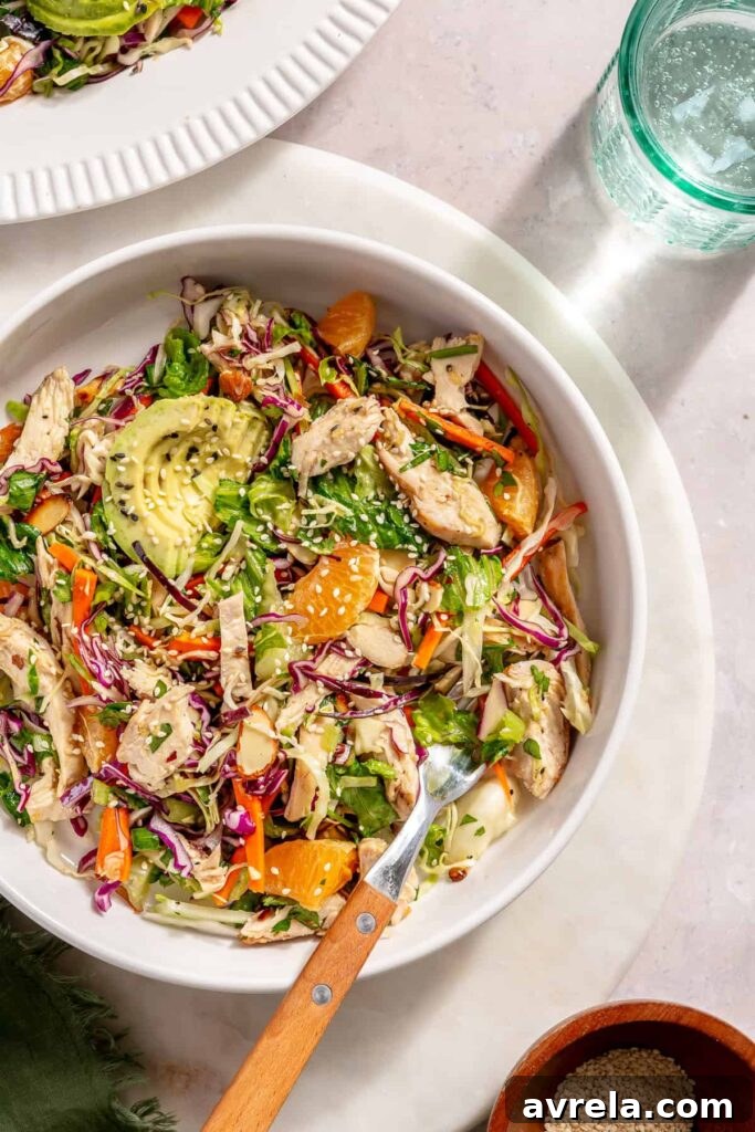 Asian chicken salad tossed with sesame ginger dressing and almonds
