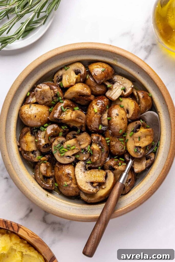 Sautéed cremini mushrooms with garlic and Italian seasoning, finished with fresh chives and flaky sea salt