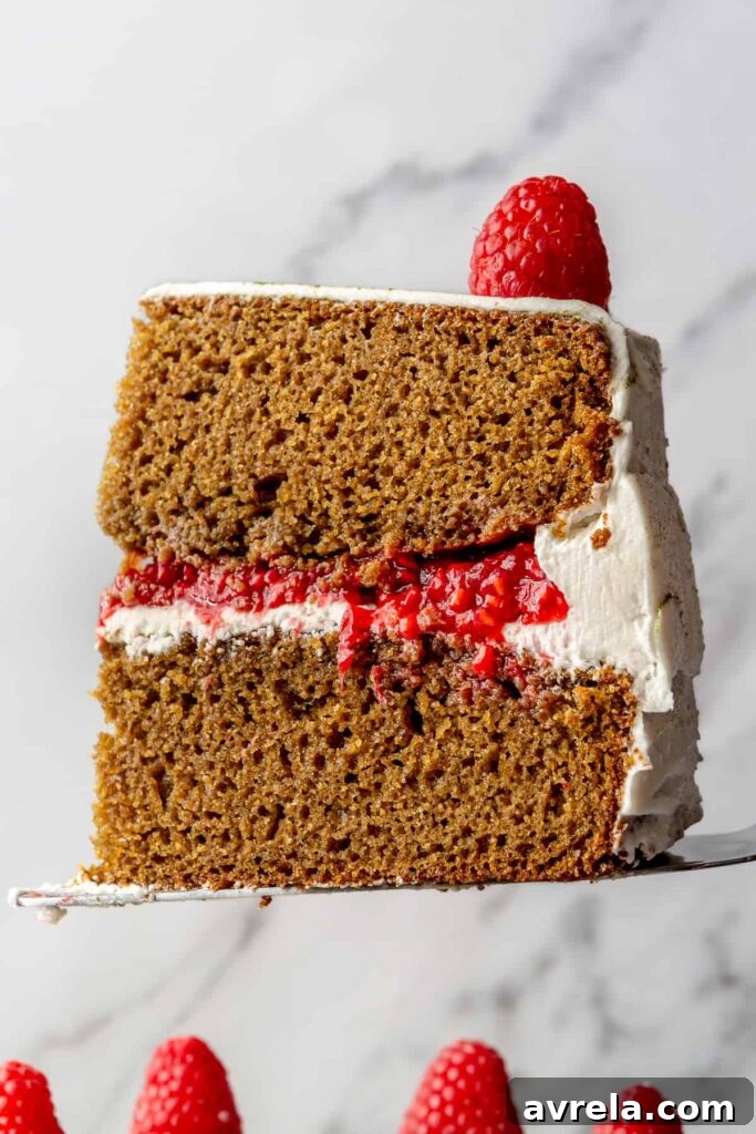 Gluten-Free Vanilla Cake with Matcha and Lemon Zest 3 Slice of gluten-free vanilla cake with matcha & lemon showcasing its moist texture.