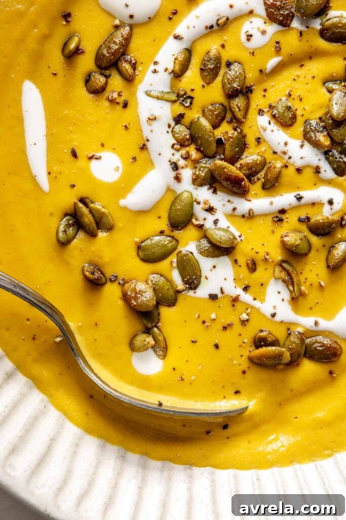 Kabocha cashew curry soup served with pumpkin seed topping – gluten-free, dairy-free recipe