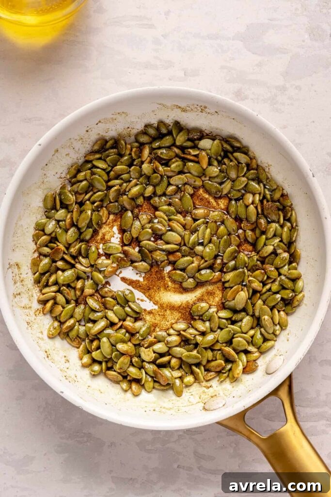 Kabocha cashew curry soup served with pumpkin seed topping – gluten-free, dairy-free recipe