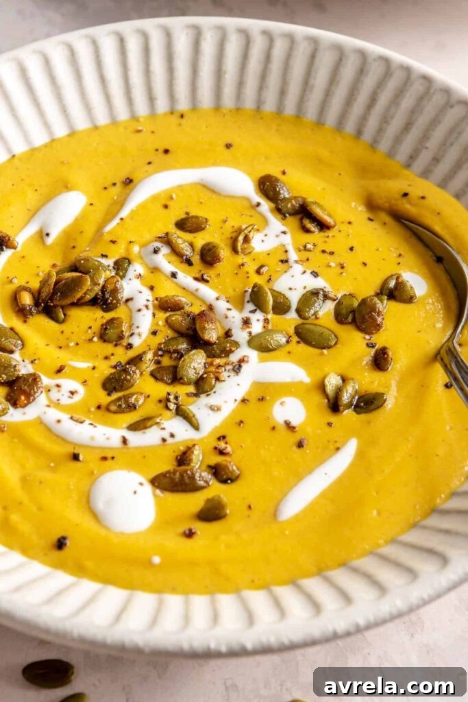 Kabocha cashew curry soup served with pumpkin seed topping – gluten-free, dairy-free recipe