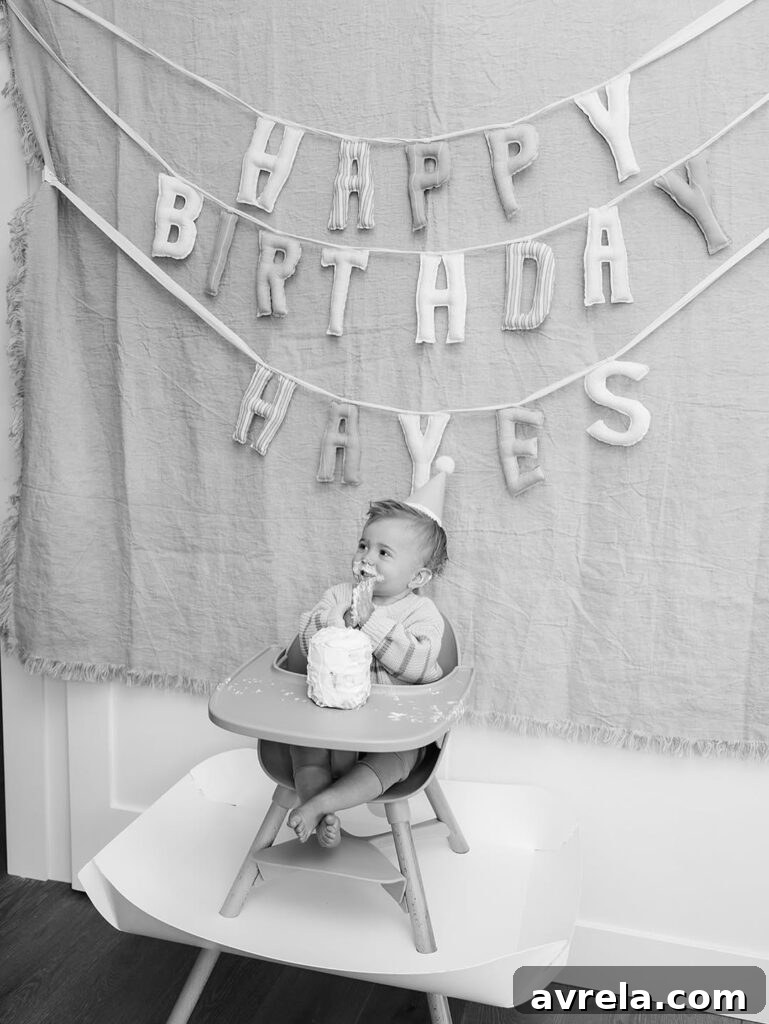 One-year-old clapping hands during birthday celebration