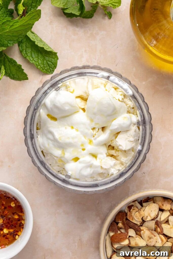 Maple-Roasted Sweet Potatoes with Whipped Feta and Hot Honey 13 Blender with feta, yogurt, olive oil, and garlic for whipped feta on roasted sweet potatoes