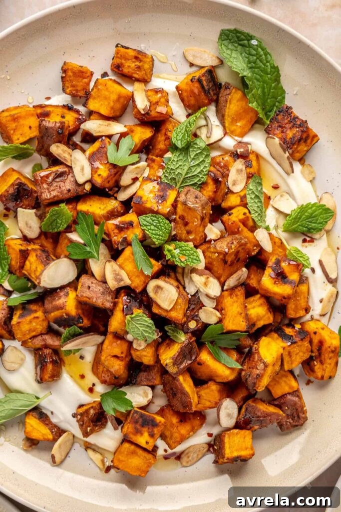 Maple-Roasted Sweet Potatoes with Whipped Feta and Hot Honey 16 Plated roasted sweet potatoes over creamy whipped feta topped with hot honey, and fresh herbs