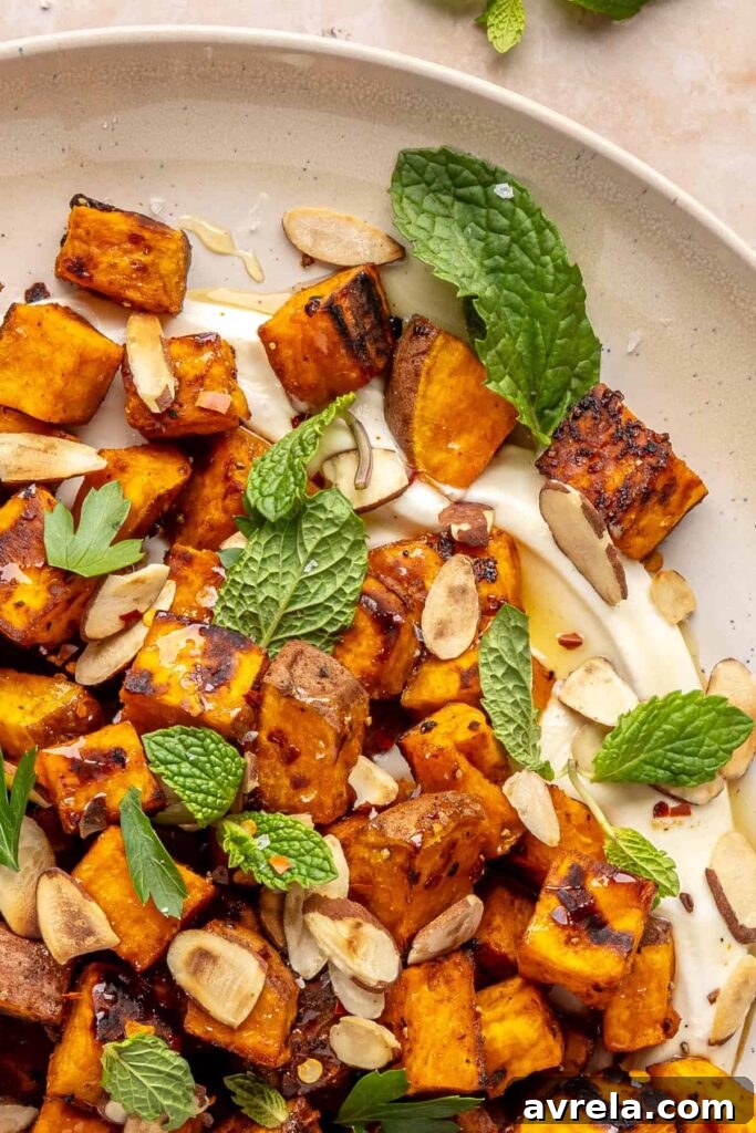Maple-Roasted Sweet Potatoes with Whipped Feta and Hot Honey 6 Plated roasted sweet potatoes over creamy whipped feta topped with hot honey, and fresh herbs