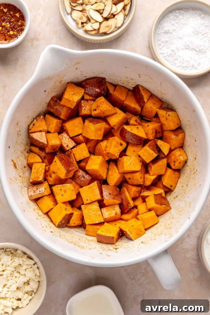 Maple-Roasted Sweet Potatoes with Whipped Feta and Hot Honey 10 sweet potato cubes in a bowl before roasting