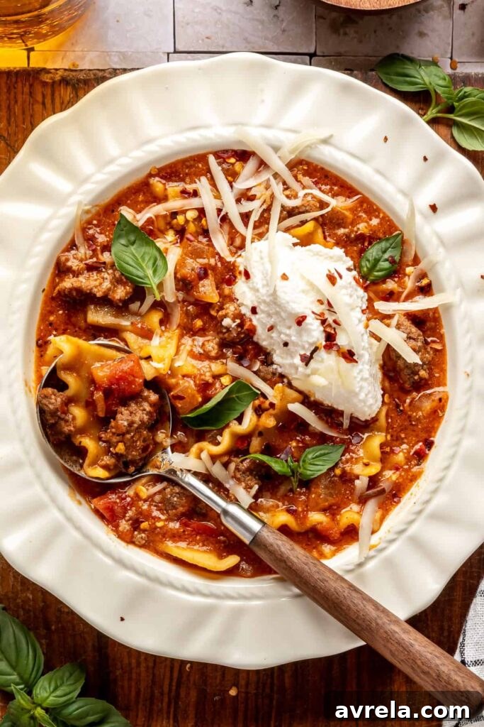 High-Protein Lasagna Soup Recipe — Easy, Hearty & Protein-Packed 2 High-protein lasagna soup in a bowl topped with dairy-free ricotta, basil, and chili flakes