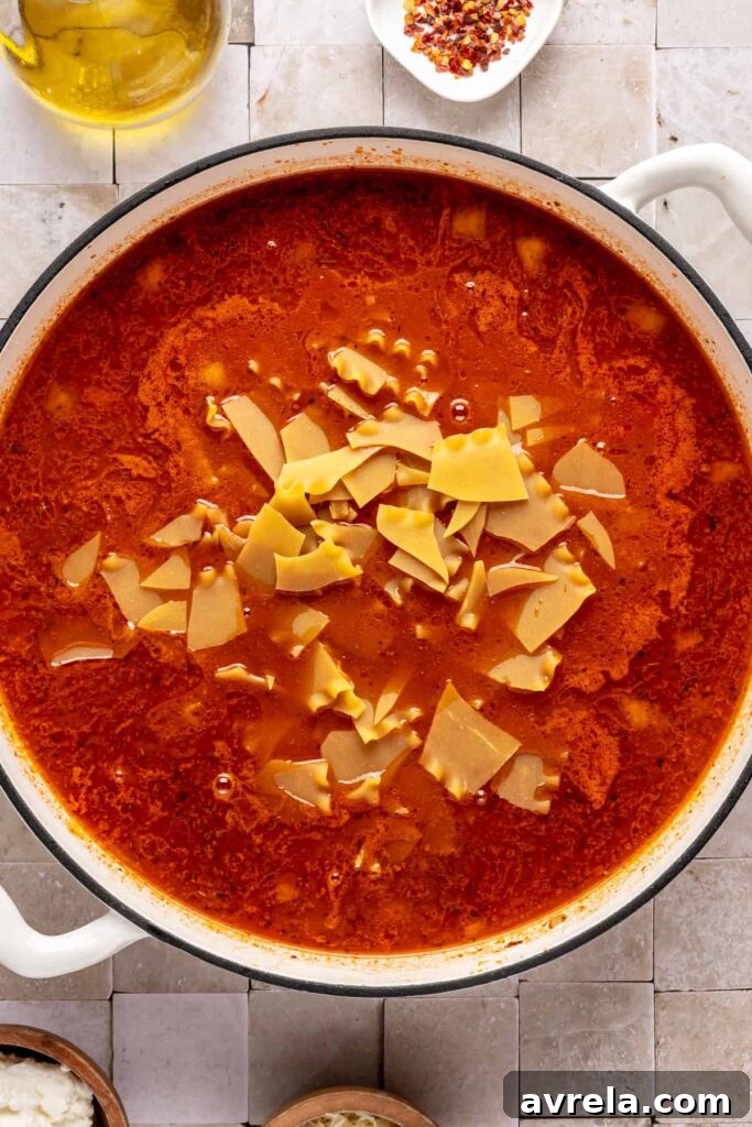 High-Protein Lasagna Soup Recipe — Easy, Hearty & Protein-Packed 11 One-pot lasagna soup simmering with ground beef, marinara, and gluten-free lasagna noodles.