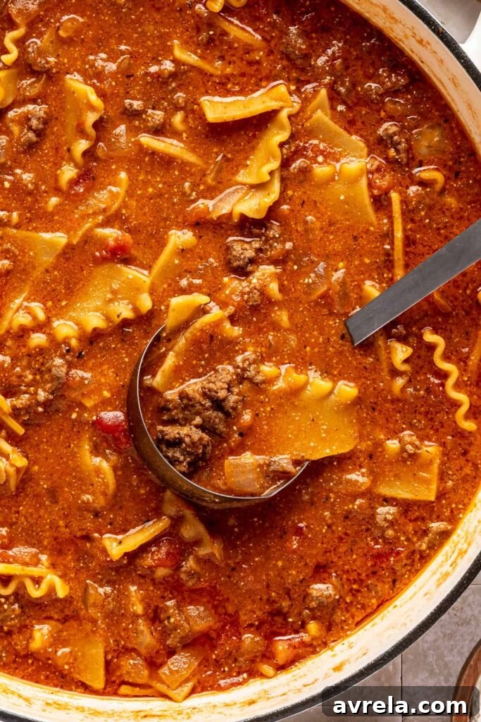High-Protein Lasagna Soup Recipe — Easy, Hearty & Protein-Packed 3 Close-up of creamy lasagna soup with broken lasagna noodles, ground beef, and ricotta.