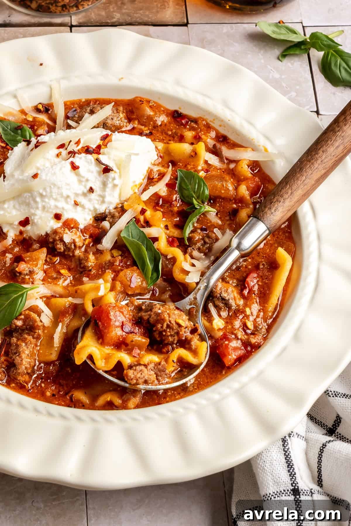 High-Protein Lasagna Soup Recipe — Easy, Hearty & Protein-Packed 15 High-protein lasagna soup in a bowl topped with dairy-free ricotta, basil, and chili flakes