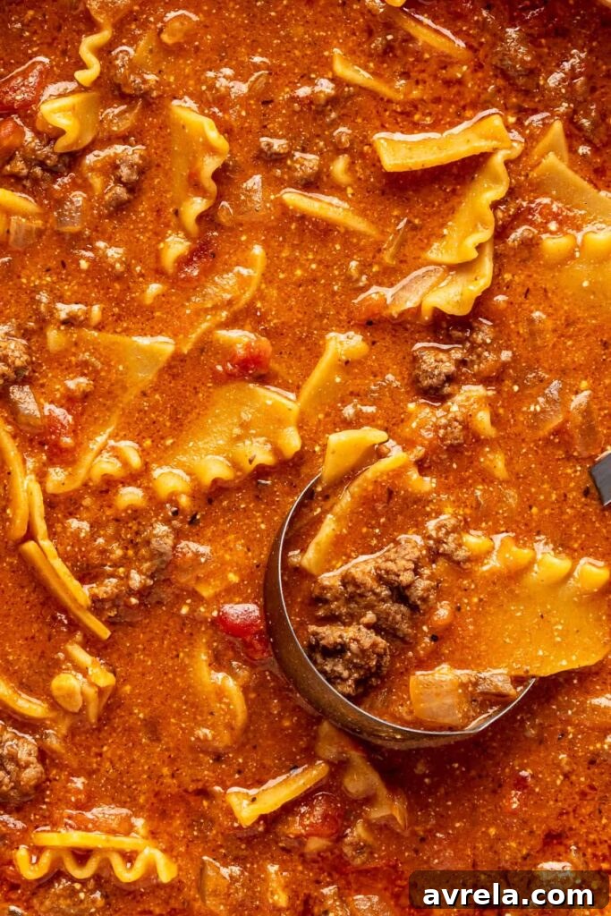 High-Protein Lasagna Soup Recipe — Easy, Hearty & Protein-Packed 4 Close-up of creamy lasagna soup with broken lasagna noodles, ground beef, and ricotta.