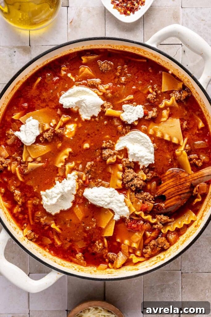 High-Protein Lasagna Soup Recipe — Easy, Hearty & Protein-Packed 6 mixing a one-pot lasagna soup with dairy-free ricotta, ground beef, marinara, and gluten-free lasagna noodles.