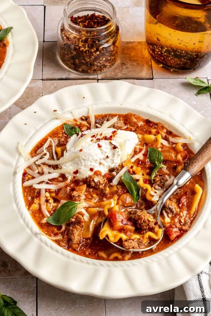 High-Protein Lasagna Soup Recipe — Easy, Hearty & Protein-Packed 8 High-protein lasagna soup in a bowl topped with dairy-free ricotta, basil, and chili flakes