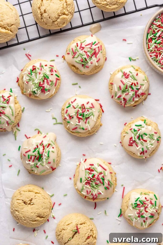 Healthy Christmas sugar cookies made with almond flour and topped with festive frosting and sprinkles
