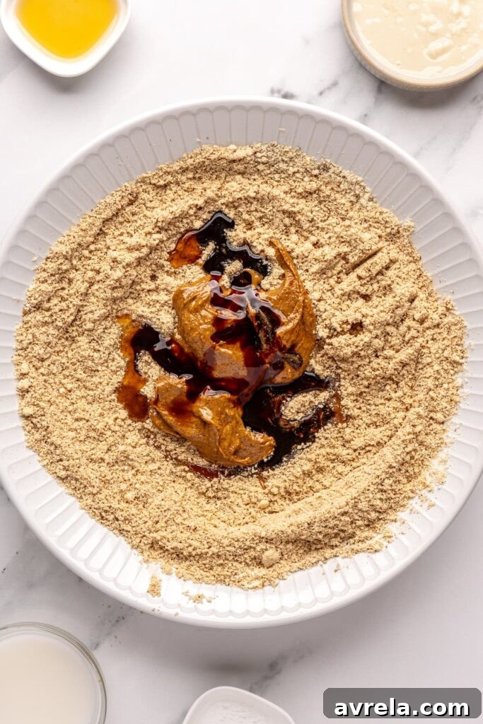 Almond butter with molasses and maple syrup, ready to mix with almond flour mixture, for gingerbread protein balls