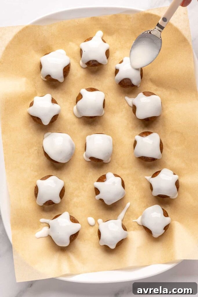 drizzling coconut butter drizzle on gingerbread protein balls