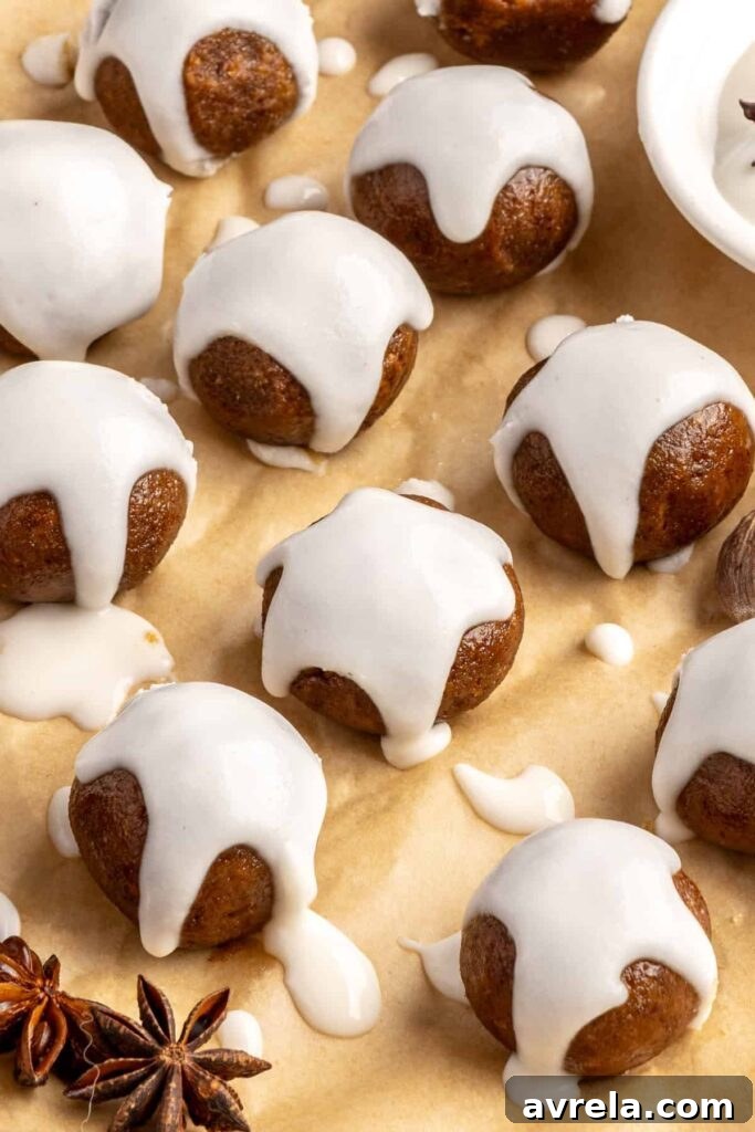 close up of chewy gingerbread protein balls with coconut butter drizzle, perfect for holiday snacks or meal prep
