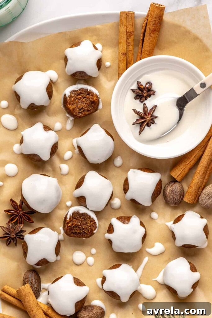 Chewy gingerbread protein balls with coconut butter drizzle and cinnamon, perfect for holiday snacks or meal prep