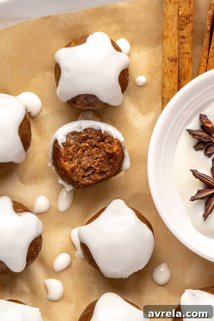 close up of chewy gingerbread protein balls with coconut butter drizzle, perfect for holiday snacks or meal prep