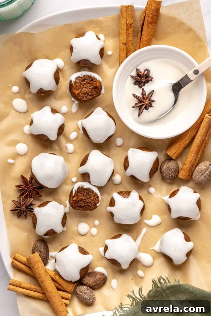Chewy gingerbread protein balls with coconut butter drizzle and cinnamon, perfect for holiday snacks or meal prep