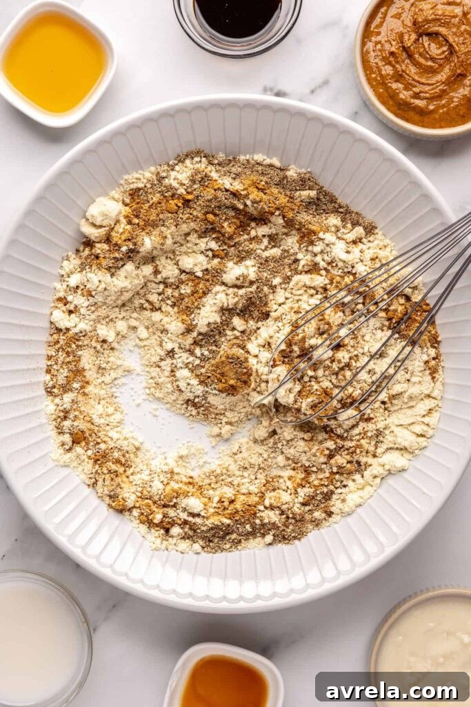 Forming gingerbread protein balls dough by combining wet and dry ingredients