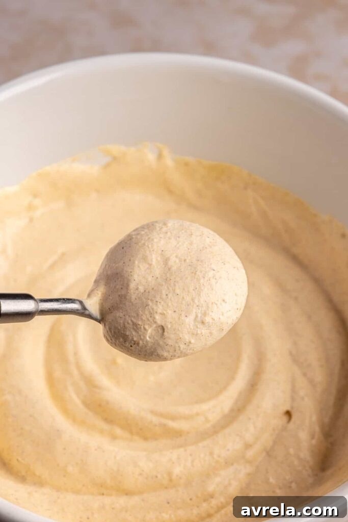 Homemade pumpkin cold foam in a bowl ready to top iced coffee