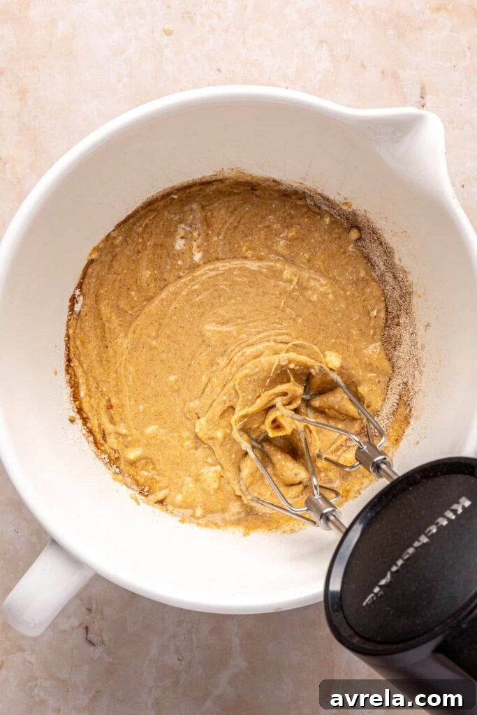 Using a frother to make airy pumpkin cold foam for iced coffee