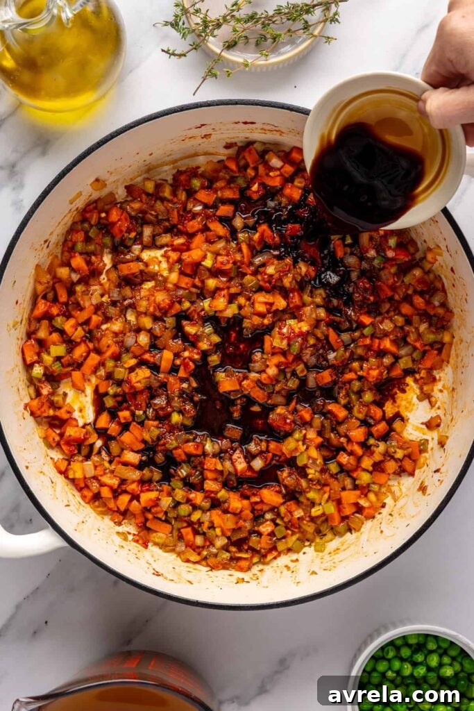 Deglazing pan with balsamic vinegar and coconut aminos for beef meatball soup