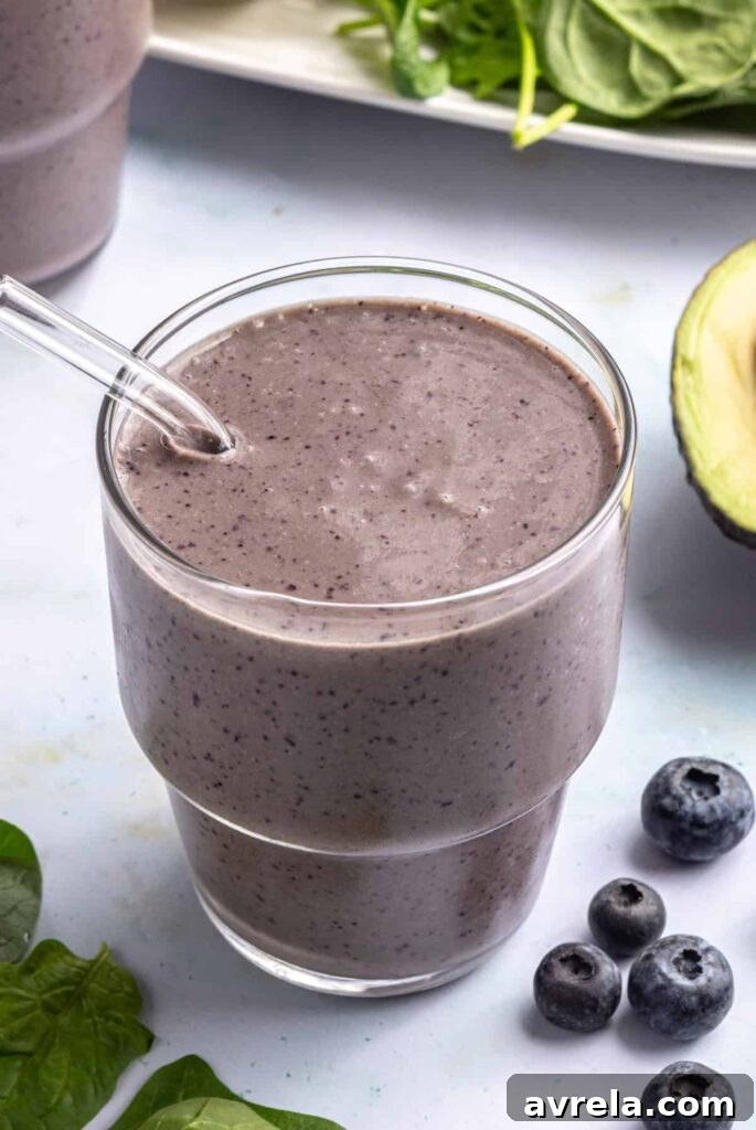 Toddler Smoothie Recipes: Nutritious, Filling & Naturally Sweetened 2 Toddler smoothie served in a glass with a reusable glass straw