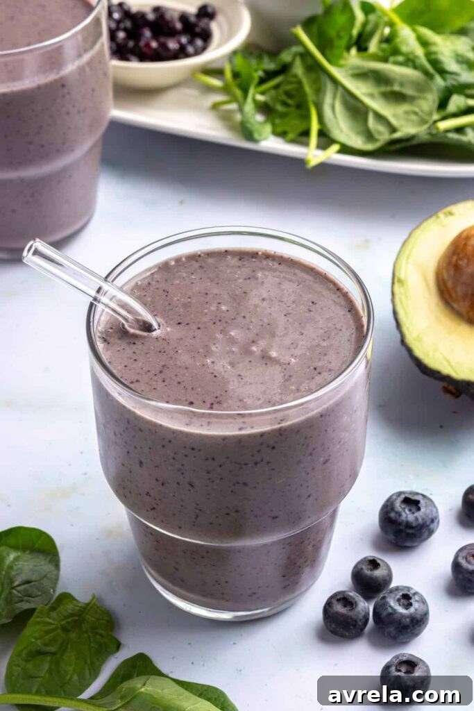 Toddler Smoothie Recipes: Nutritious, Filling & Naturally Sweetened 11 Toddler smoothie served in a glass with a reusable glass straw