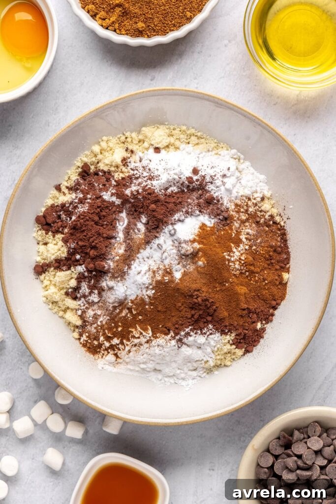 Dry ingredients for hot cocoa cookies in a medium mixing bowl