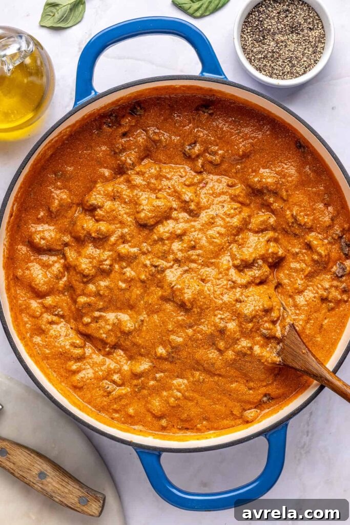 Cooked ground meat stirred into creamy vodka sauce with hidden vegetables