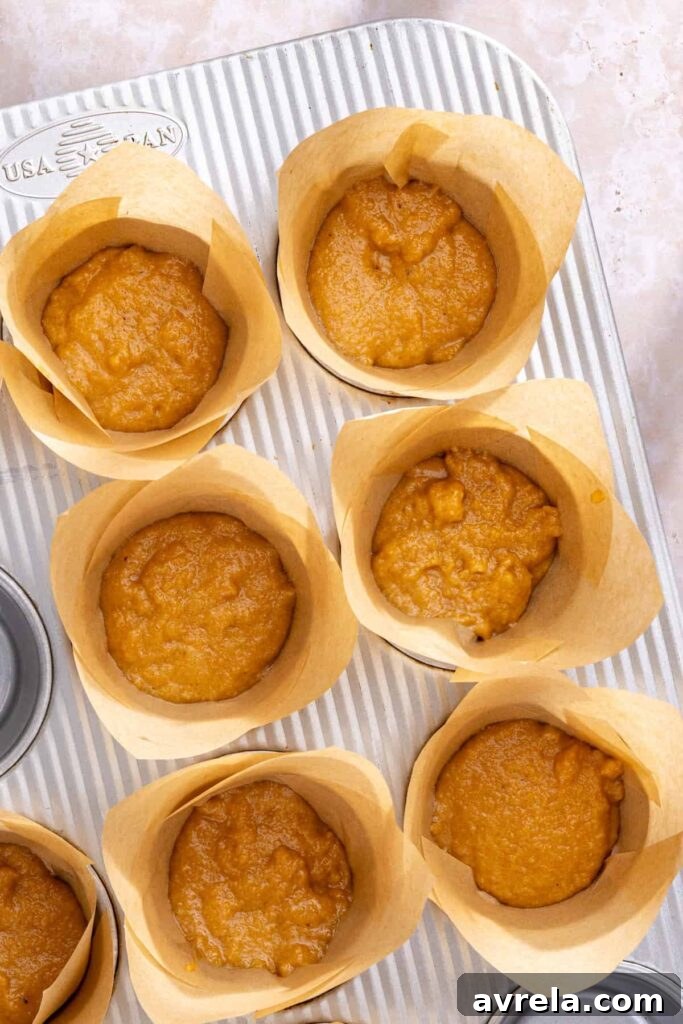 Dividing gluten-free muffin batter evenly into muffin cups