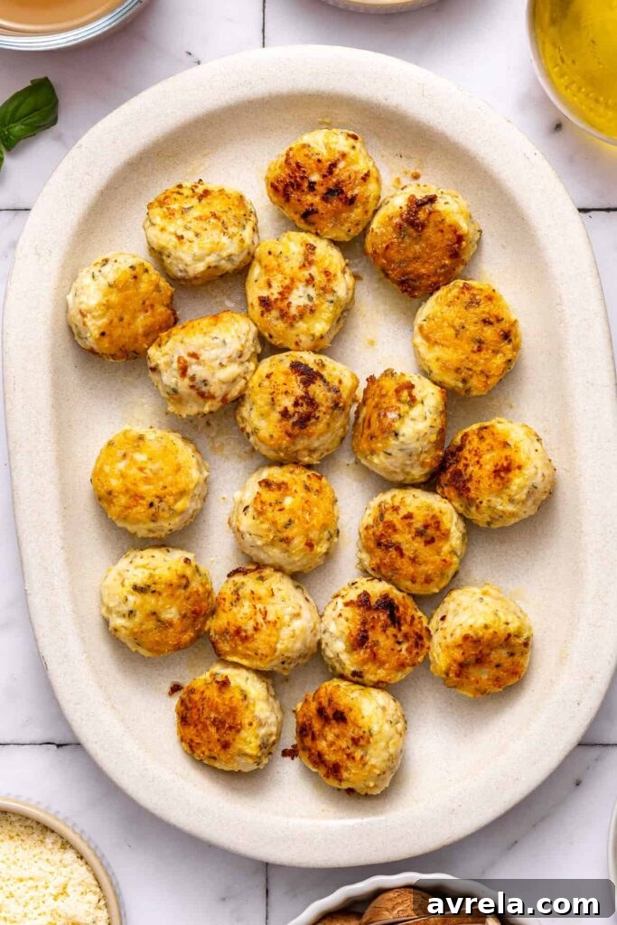 marry me chicken meatballs cooked and resting on a serving tray before going back in skillet