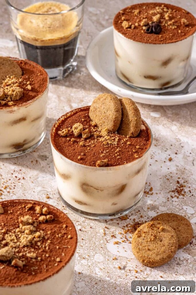 High-protein tiramisu cups served with espresso on a set table