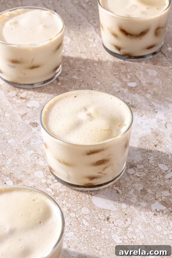 No-bake tiramisu cups fully layered and set after refrigeration