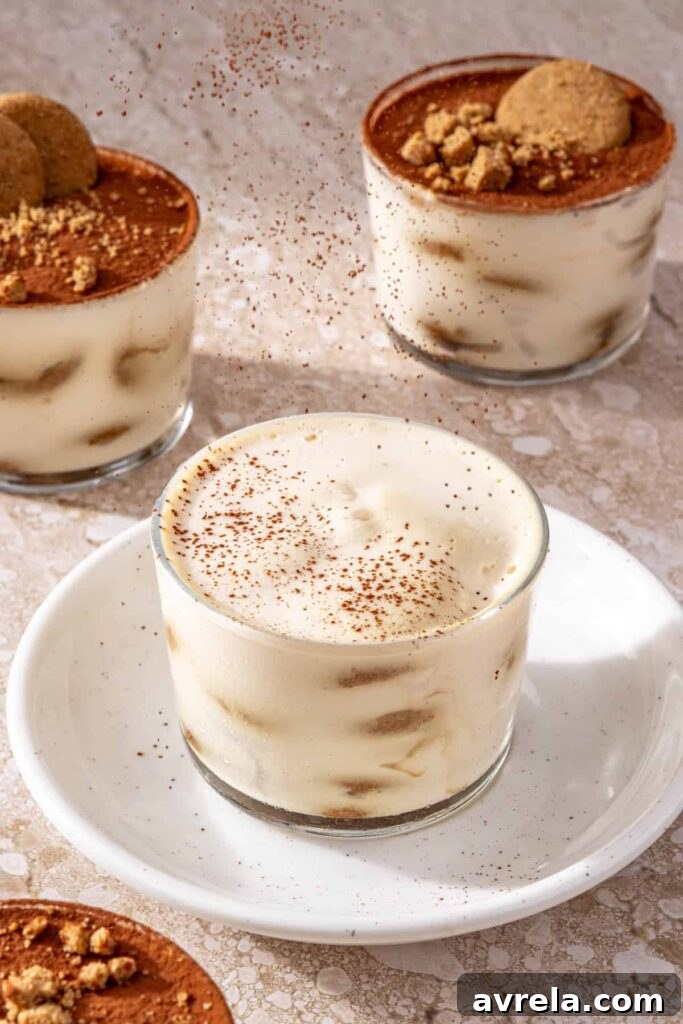 Sifting cocoa powder on top of tiramisu before serving